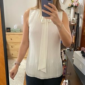 White pleated blouse